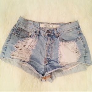 High waisted distressed denim shorts.